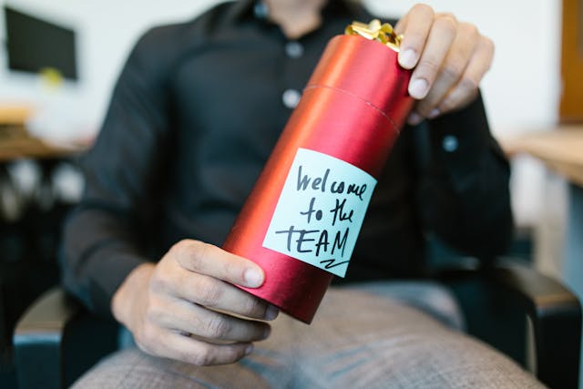 Photo by RDNE Stock Project: https://www.pexels.com/photo/man-holding-a-red-present-7581000/